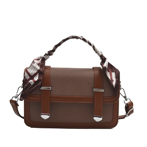 Brown canvas and leather shoulder bag with decorative scarf handle and metal buckles