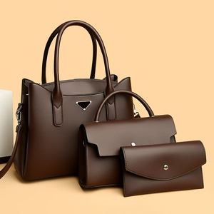 Three-piece set of deep brown lychee leather tote bags with metal triangle logo
