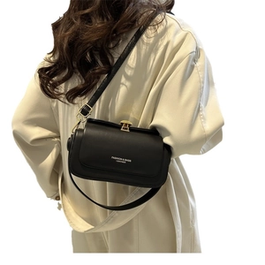 Chic black leather crossbody box bag with gold twist lock and adjustable shoulder strap