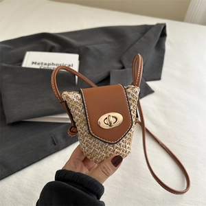 Mini straw woven crossbody bag with brown leather flap and gold metal twist lock