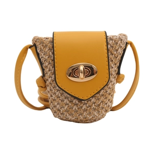 Mini woven crossbody bag with straw texture and yellow faux leather flap and strap