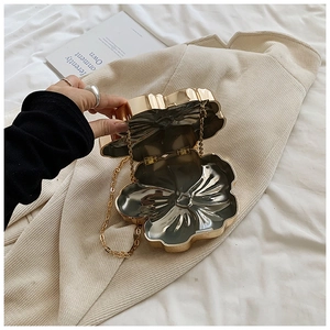Elegant gold shell evening clutch bag with metal chain strap for formal occasions
