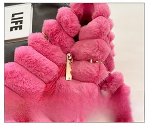Detail showing high-quality gold metal zipper on rose pink faux fur vest for women