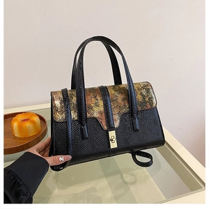 Detail of flap bag with colorful metallic scales, leather texture and rotary metal lock