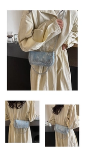 Detailed view of light blue sequined crossbody bag with silver thick chain and zip closure