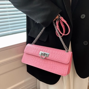 Pink crocodile-embossed leather crossbody bag with silver chain and metal clasp