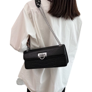 Minimalist black crocodile embossed crossbody bag with silver chain and metal buckle