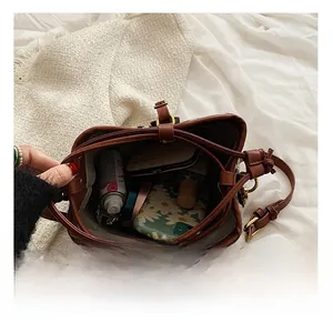 Top view of brown PU leather bucket bag interior showing large storage capacity