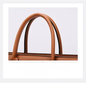 Detail of caramel brown lychee pattern tote bag showing high-quality handle and black oil edge