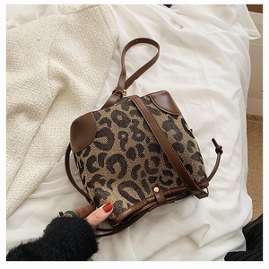 Leopard print bucket bag in canvas and brown leather with drawstring closure