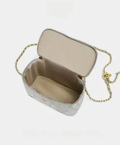 Detail of silver quilted handbag interior showing spacious capacity for daily essentials
