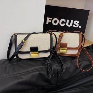 Retro canvas and leather crossbody bag with flap closure and golden metal buckle