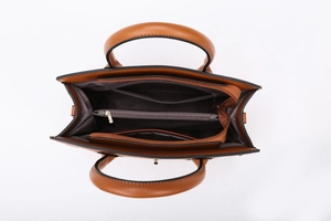 Detailed interior of the brown tote bag featuring multiple compartments and a center zipper pocket