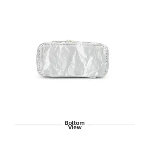 Detailed bottom view of silver textured handbag showing neat stitching and metallic finish