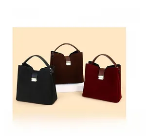 Three cowhide bucket bags in black, burgundy and dark brown with metal locks and top handles