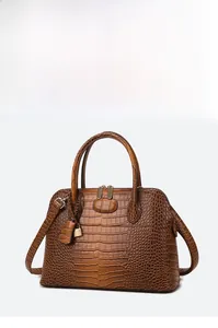 Brown crocodile embossed leather handbag with round handles and detachable strap detail