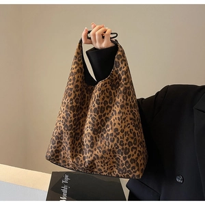 Close-up of stylish leopard print shoulder bag with soft canvas texture and large capacity