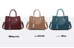 Three elegant tote bags in purple, khaki and blue with pebbled leather and gold charms