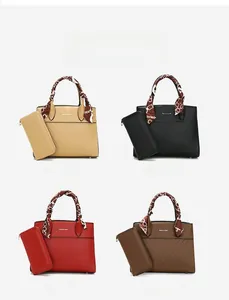 Four colors of embossed tote bags with matching wallets and decorative handle scarves