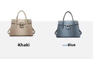 Detail view of khaki and blue faux crocodile skin tote bags with gold tone hardware