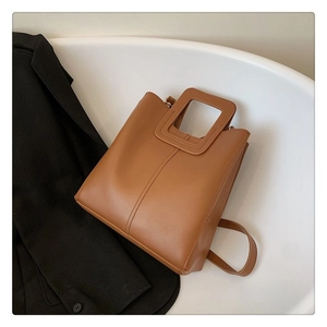 Retro brown tote bag with square cutout handles and adjustable shoulder strap for women