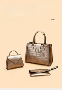 Close-up of retro bronze composite leather 3-piece bag set with elephant print and H buckle