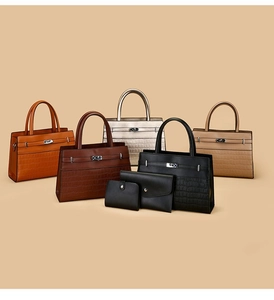Collection of crocodile embossed leather tote bags and wallets in various fashion colors