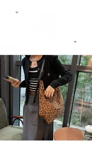 Detailed view of leopard print hobo bag with black strap in a cozy cafe setting
