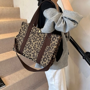 Large capacity leopard print canvas tote bag with brown handles and adjustable strap