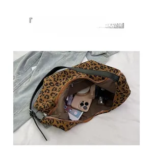 Leopard print crossbody bag interior view showing large capacity storage and compartments