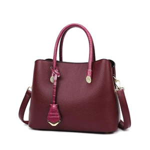 Burgundy faux leather tote bag with snakeskin texture and gold hardware for women