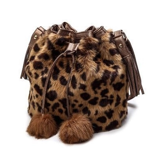 Winter faux fur bucket bag with leopard print, bronze leather strap and pom pom charms