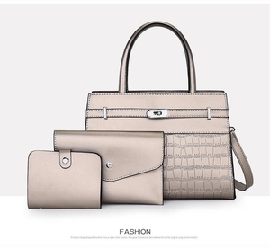 Three-piece champagne gold handbag set with crocodile pattern and metal lock detail