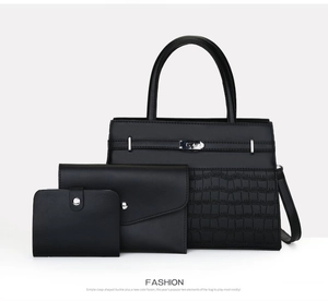 Three-piece set featuring large black tote with crocodile texture and buckle detail