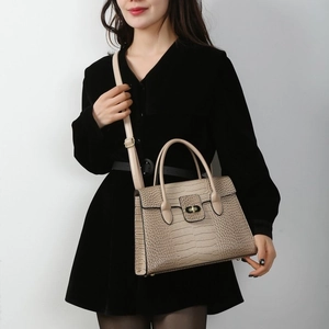 Beige croco-embossed tote bag with gold metal lock and detachable shoulder strap