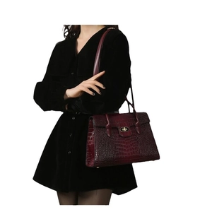 Deep red crocodile texture tote bag with high-gloss finish and gold twist-lock closure