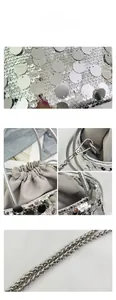 Close-up of sparkling silver sequins and metal chain strap on a stylish bucket bag
