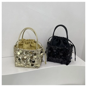 Detailed comparison of gold and black sequin bucket bags with drawstring and chain strap
