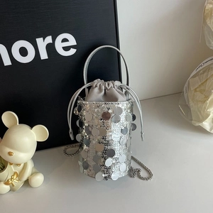 Sparkly silver sequin bucket bag with drawstring closure and chain strap for women