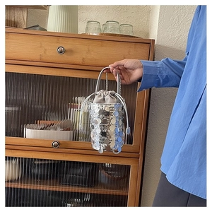 Chic silver sequin bucket bag for women with shiny mirror finish and chain strap