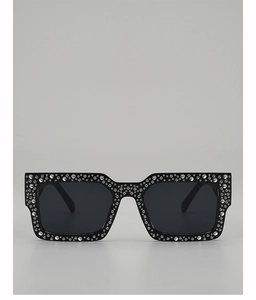 Close-up of luxury rectangular sunglasses featuring a black frame with full crystal rhinestones