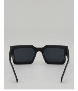 Detail of classic black square sunglasses with dark grey lenses and polished resin frame