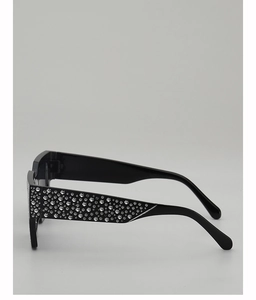 Detail of retro rectangle sunglasses featuring crystal-encrusted temples and black frames