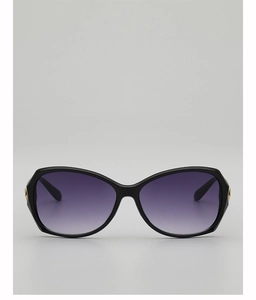 Detail of oversized black frame sunglasses with purple gradient lenses and gold accents