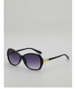 Macro view of butterfly sunglasses with gradient lenses and golden metal hinge detail