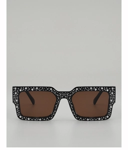 Macro shot of rectangular sunglasses with silver rhinestones and brown gradient lenses