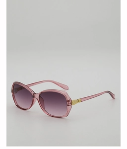 Macro detail of golden vintage hinge on pink oversized gradient lens sunglasses
