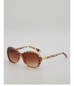 Detail of leopard print sunglasses frame with gradient brown lenses and gold metal accents