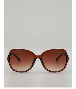 Makro-Detail der bernsteinfarbenen Schmetterlingsbrille mit braunen Verlaufsgläsern