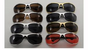 Detailed overhead view of multiple wrap-around sports sunglasses in various metallic frames